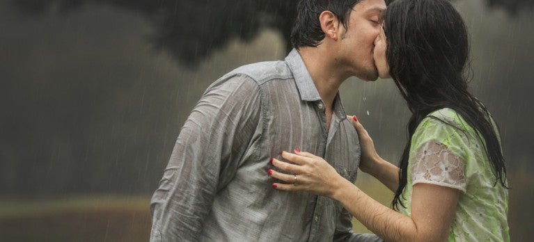 Couple kissing in the rain